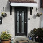 Residential uPVC door canopy over black door